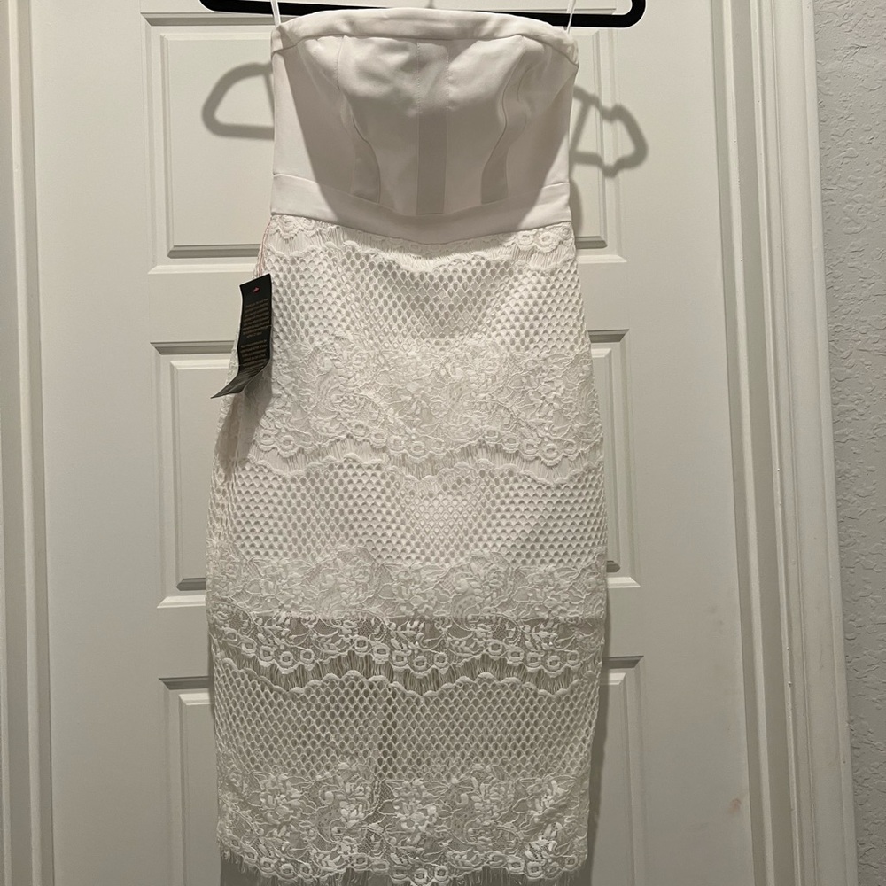 Strapless white lace BeBe dress.  New! Never worn. Perfect condition